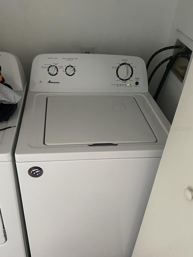 clothes washing area featuring washer / clothes dryer