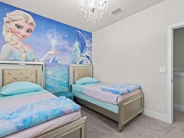 bedroom with carpet flooring, a textured ceiling, and a notable chandelier