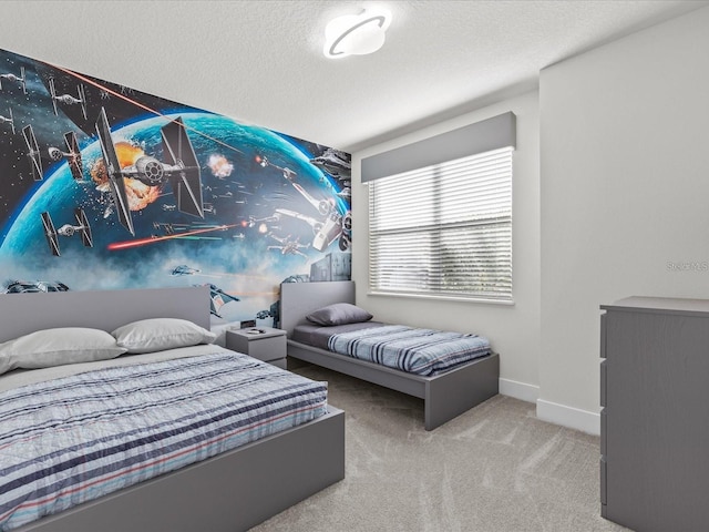 carpeted bedroom featuring a textured ceiling