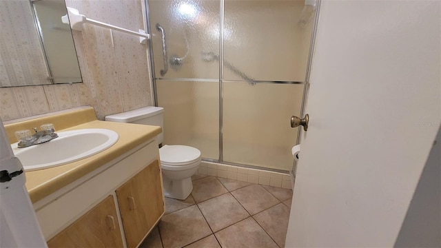 bathroom featuring walk in shower, oversized vanity, toilet, and tile flooring