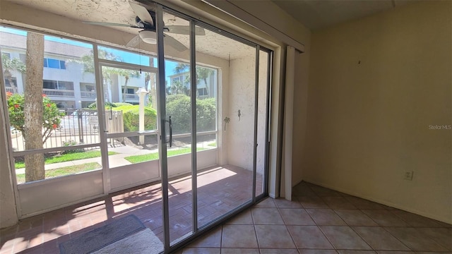 entryway featuring tile flooring and ceiling fan