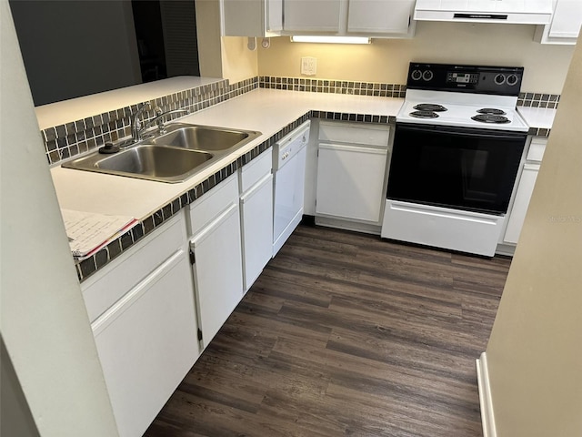 kitchen featuring white cabinets, sink, white appliances, and dark hardwood / wood-style floors