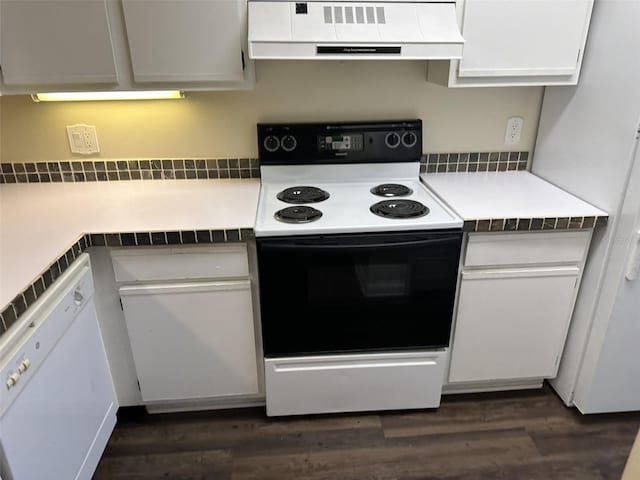 kitchen with white cabinetry, dark hardwood / wood-style flooring, tile countertops, and white appliances