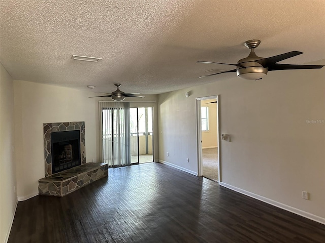 unfurnished living room with plenty of natural light, dark hardwood / wood-style flooring, and ceiling fan