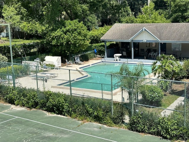 view of swimming pool featuring a patio area