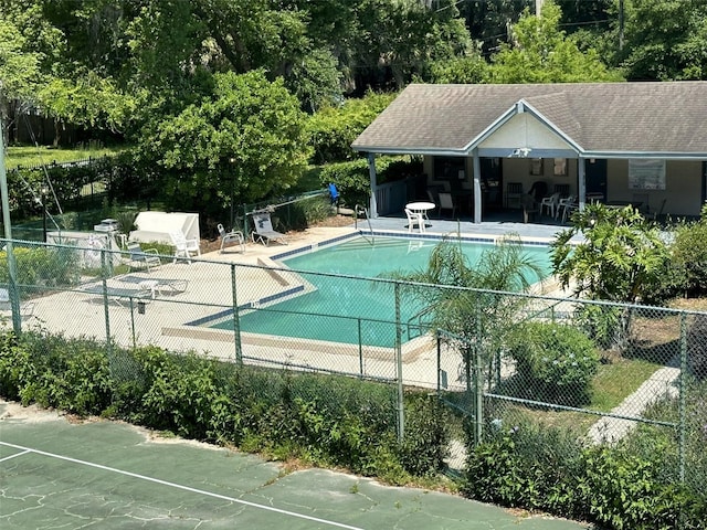 view of swimming pool with a patio area