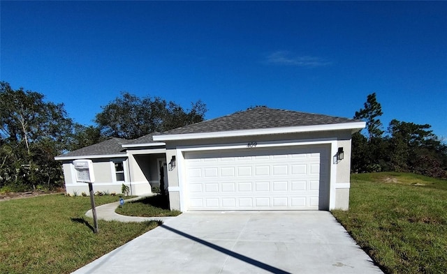 ranch-style house featuring a garage and a front lawn