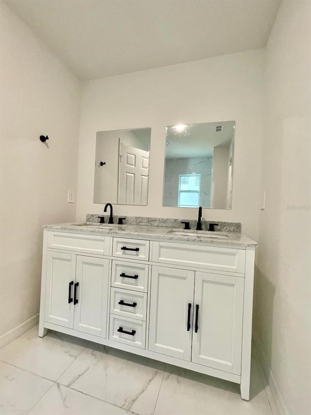 bathroom featuring tile flooring and double sink vanity