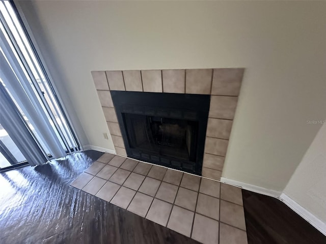 details featuring tile flooring and a tiled fireplace