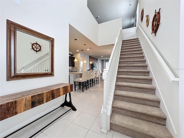 stairway featuring light tile floors