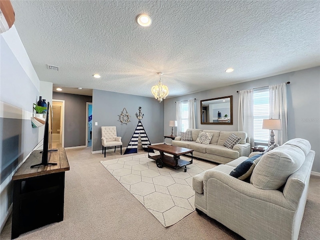 living room featuring light colored carpet, a textured ceiling, and a notable chandelier