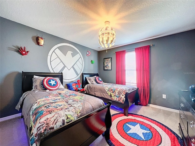 bedroom featuring carpet flooring, an inviting chandelier, and a textured ceiling