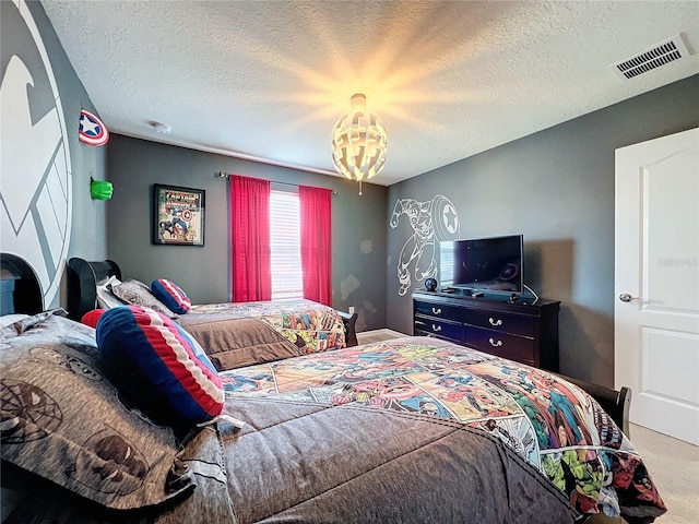 carpeted bedroom with a textured ceiling