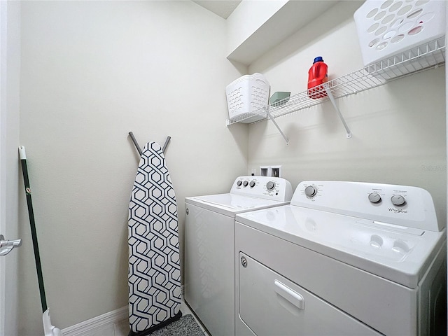 washroom featuring washing machine and dryer