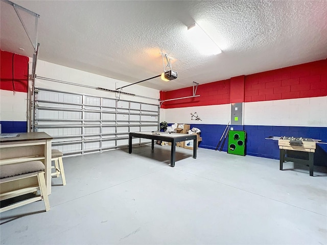 interior space featuring a textured ceiling and concrete floors