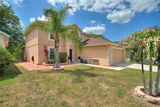 view of front of property featuring a garage and a front lawn