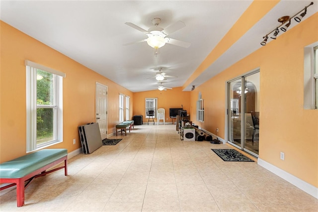 interior space with tile flooring and ceiling fan