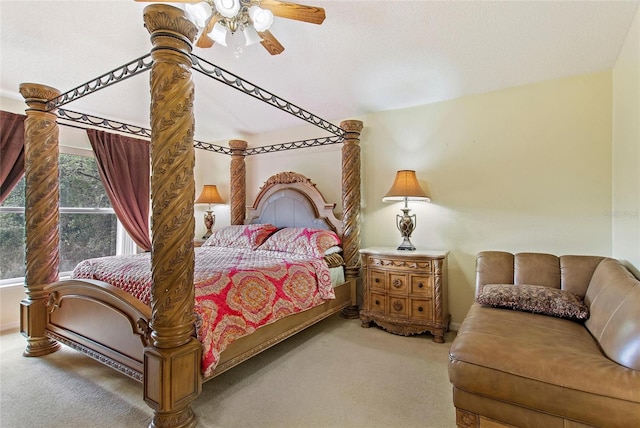 bedroom featuring vaulted ceiling, a textured ceiling, ceiling fan, and carpet floors