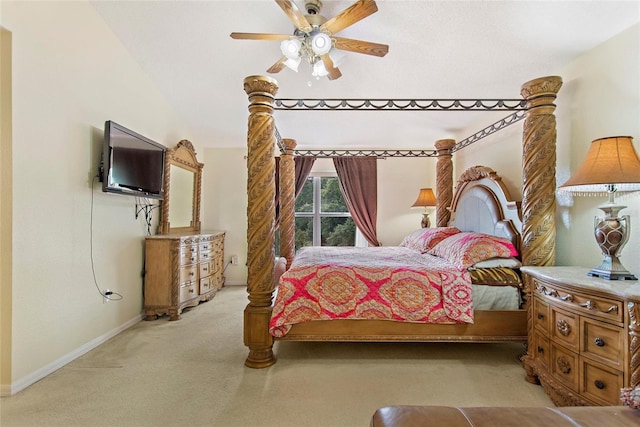 carpeted bedroom featuring ceiling fan and vaulted ceiling