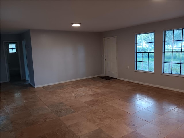 unfurnished room featuring tile flooring