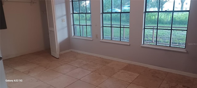 tiled empty room with plenty of natural light