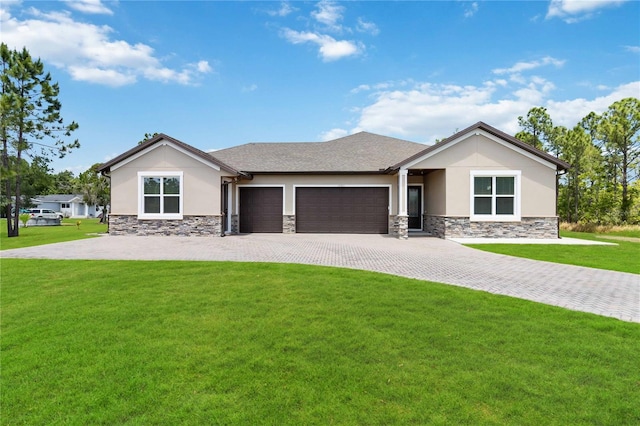 view of front facade featuring a front lawn and a garage