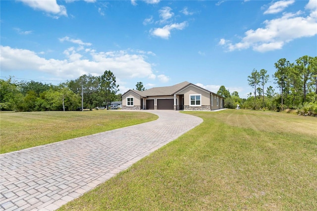 ranch-style home featuring a front yard and a garage