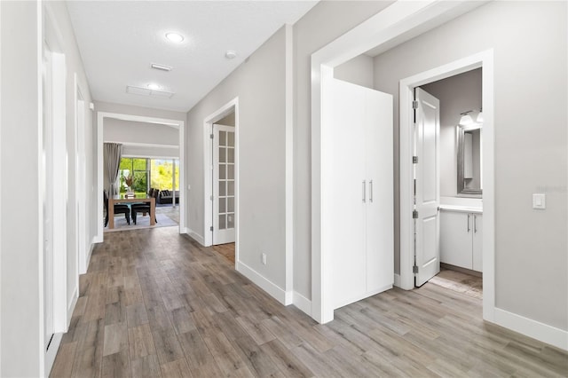 hallway featuring light wood-type flooring