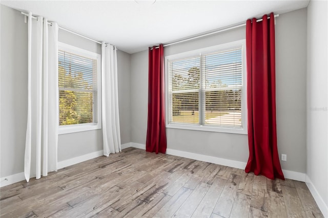 spare room featuring light hardwood / wood-style flooring