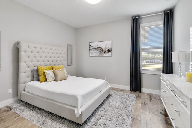 bedroom featuring light wood-type flooring