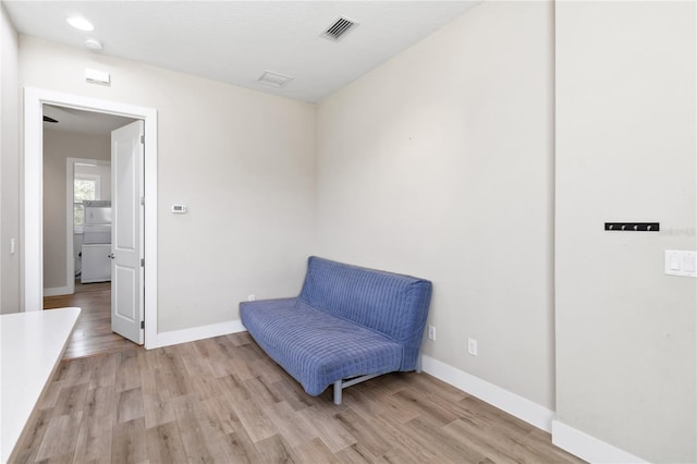 sitting room with light hardwood / wood-style flooring