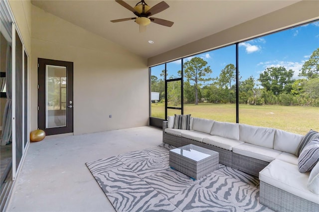 sunroom / solarium with vaulted ceiling and ceiling fan