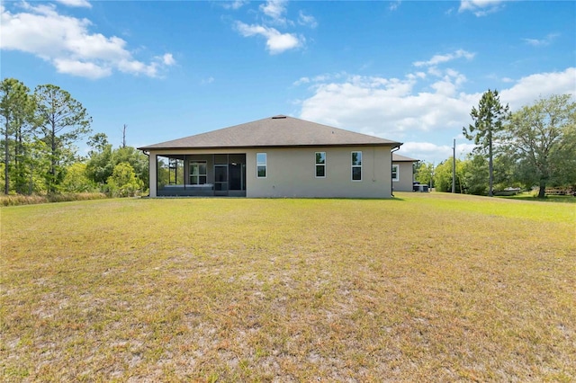 back of house with a yard