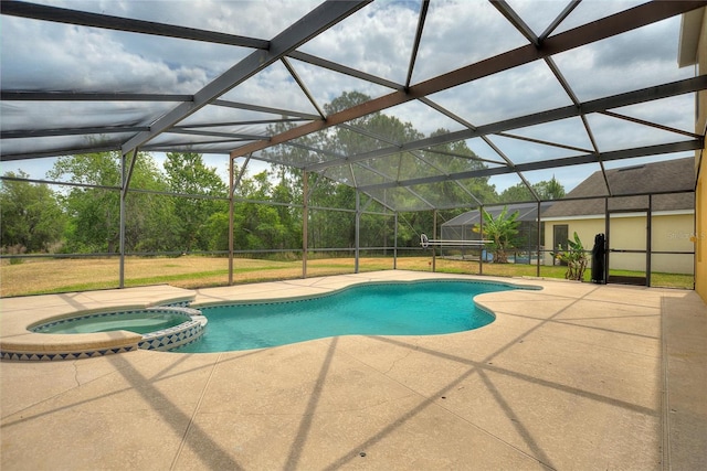 view of swimming pool featuring a patio, glass enclosure, and an in ground hot tub