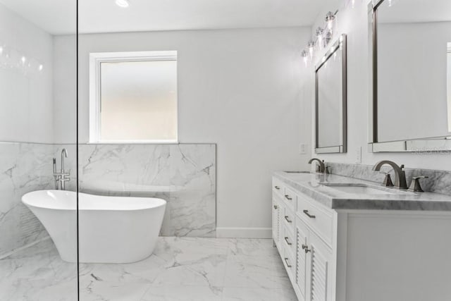 bathroom with tile walls, tile flooring, a bath, and double sink vanity