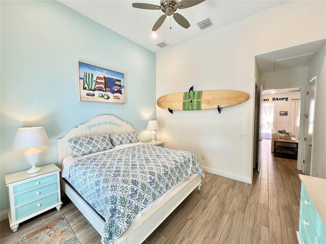 bedroom featuring ceiling fan and hardwood / wood-style flooring