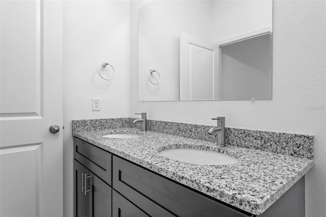 bathroom with dual bowl vanity