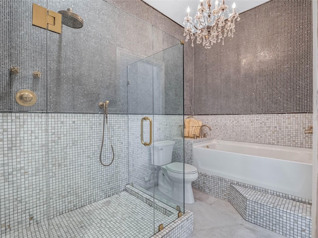 bathroom with independent shower and bath, toilet, tile walls, and a notable chandelier