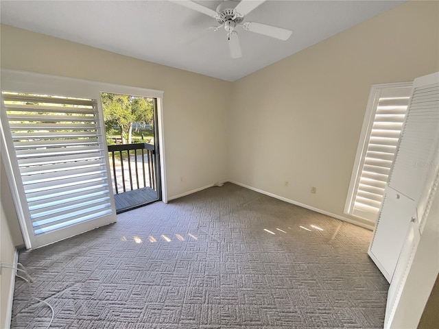 carpeted empty room with ceiling fan