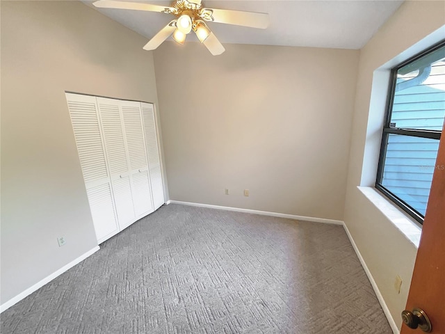 unfurnished bedroom with a closet, ceiling fan, and multiple windows