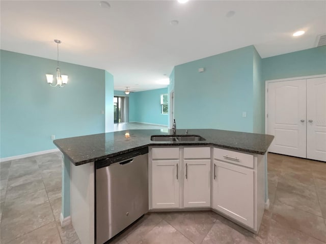 kitchen featuring sink, a center island with sink, light tile floors, and stainless steel dishwasher