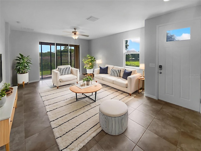 33083 Windelstraw Dr, Wesley Chapel, FL 33545 - living room with a ceiling fan, tile patterned floors, and baseboards