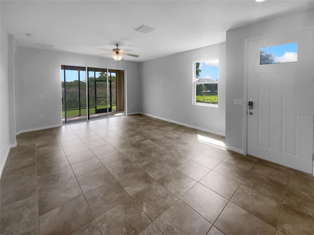 33083 Windelstraw Dr, Wesley Chapel, FL 33545 - tiled foyer with a ceiling fan and baseboards