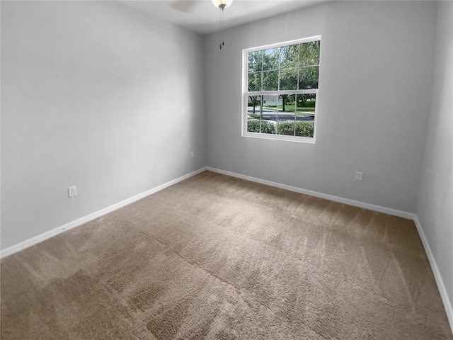 33083 Windelstraw Dr, Wesley Chapel, FL 33545 - carpeted spare room featuring ceiling fan and baseboards