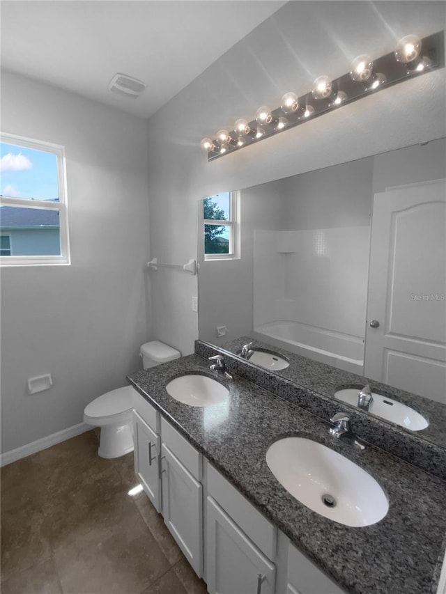 33083 Windelstraw Dr, Wesley Chapel, FL 33545 - bathroom with healthy amount of natural light, double vanity, washtub / shower combination, and tile patterned flooring