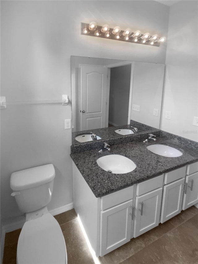 33083 Windelstraw Dr, Wesley Chapel, FL 33545 - bathroom featuring double vanity and tile patterned flooring