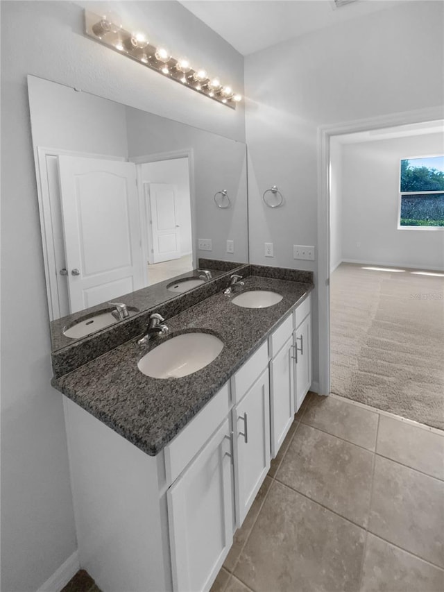 33083 Windelstraw Dr, Wesley Chapel, FL 33545 - full bathroom featuring double vanity, tile patterned floors, and baseboards