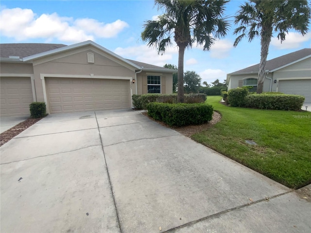 33083 Windelstraw Dr, Wesley Chapel, FL 33545 - ranch-style house featuring concrete driveway, a front yard, stucco siding, and a garage