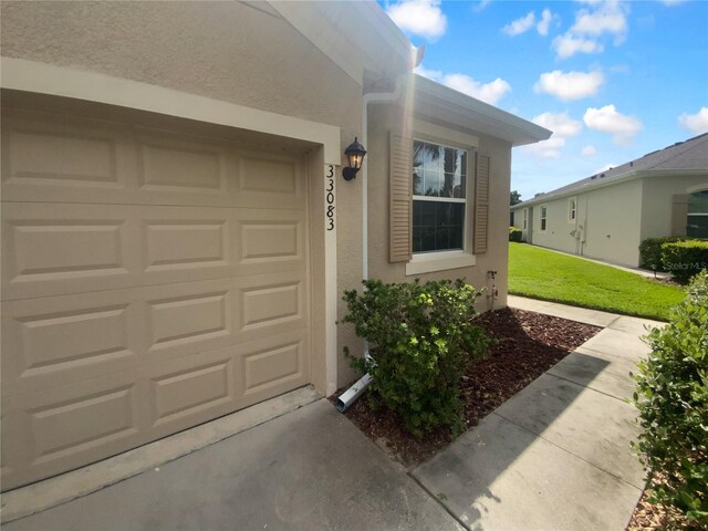 33083 Windelstraw Dr, Wesley Chapel, FL 33545 - garage with concrete driveway