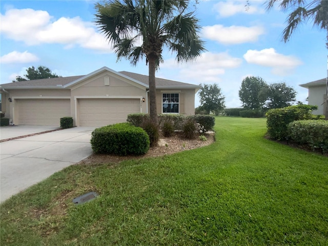 33083 Windelstraw Dr, Wesley Chapel, FL 33545 - view of side of property featuring stucco siding, an attached garage, driveway, and a lawn